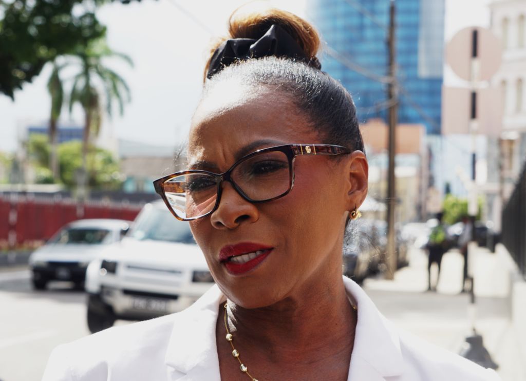 Independent Senator Dr Marlene Attzs speaks to members of the media outside Parliament on Tuesday.